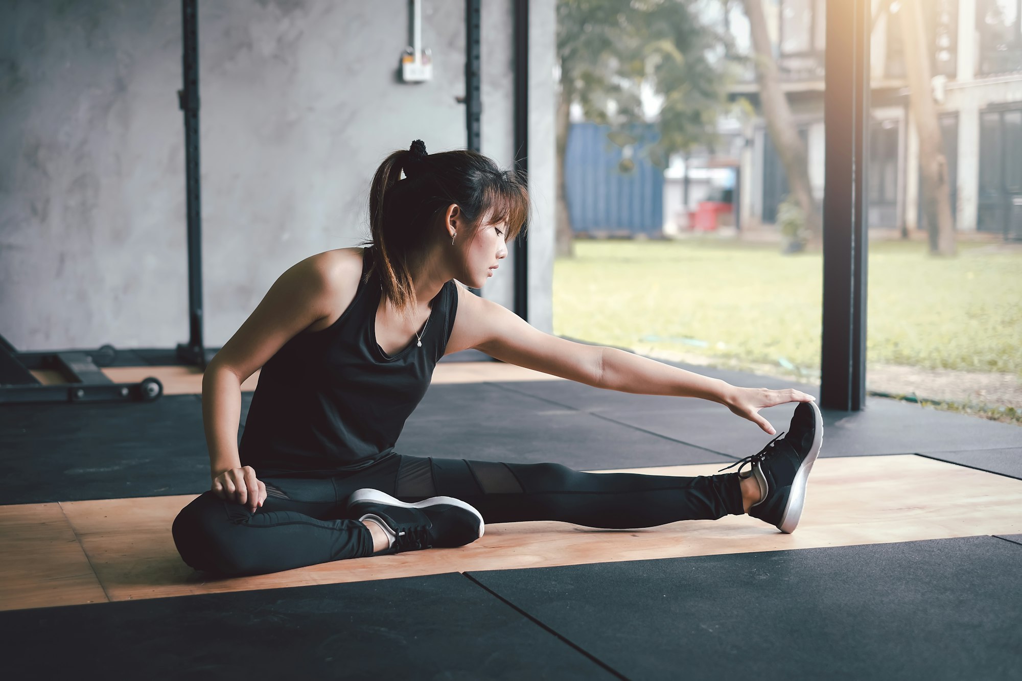 Image Asian woman Stretching at the gym